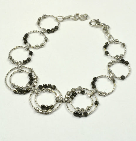 Officina Bernardi, Sterling Silver & Black 9-circle Saturn Bracelet